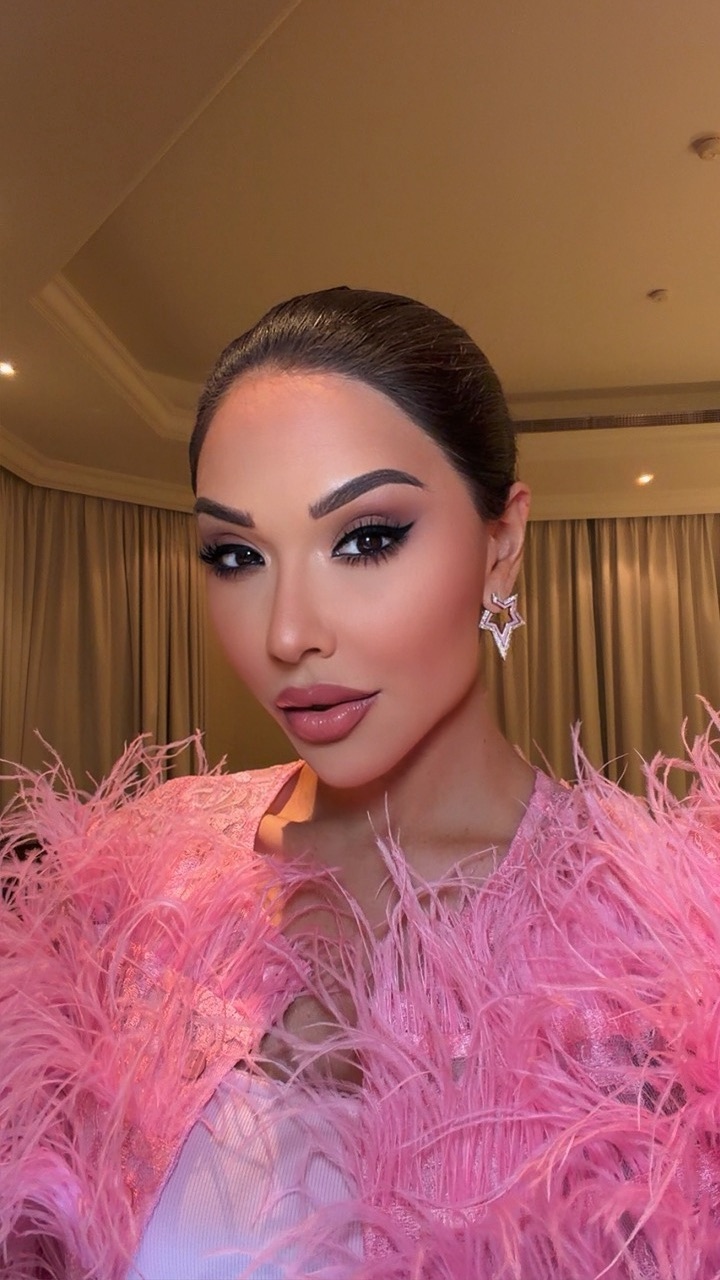 Elham Alarif in a playful pink feather beauty look
