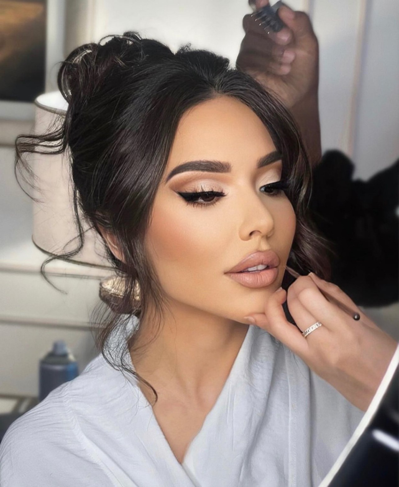 Close up makeup application shot of Elham Alarif